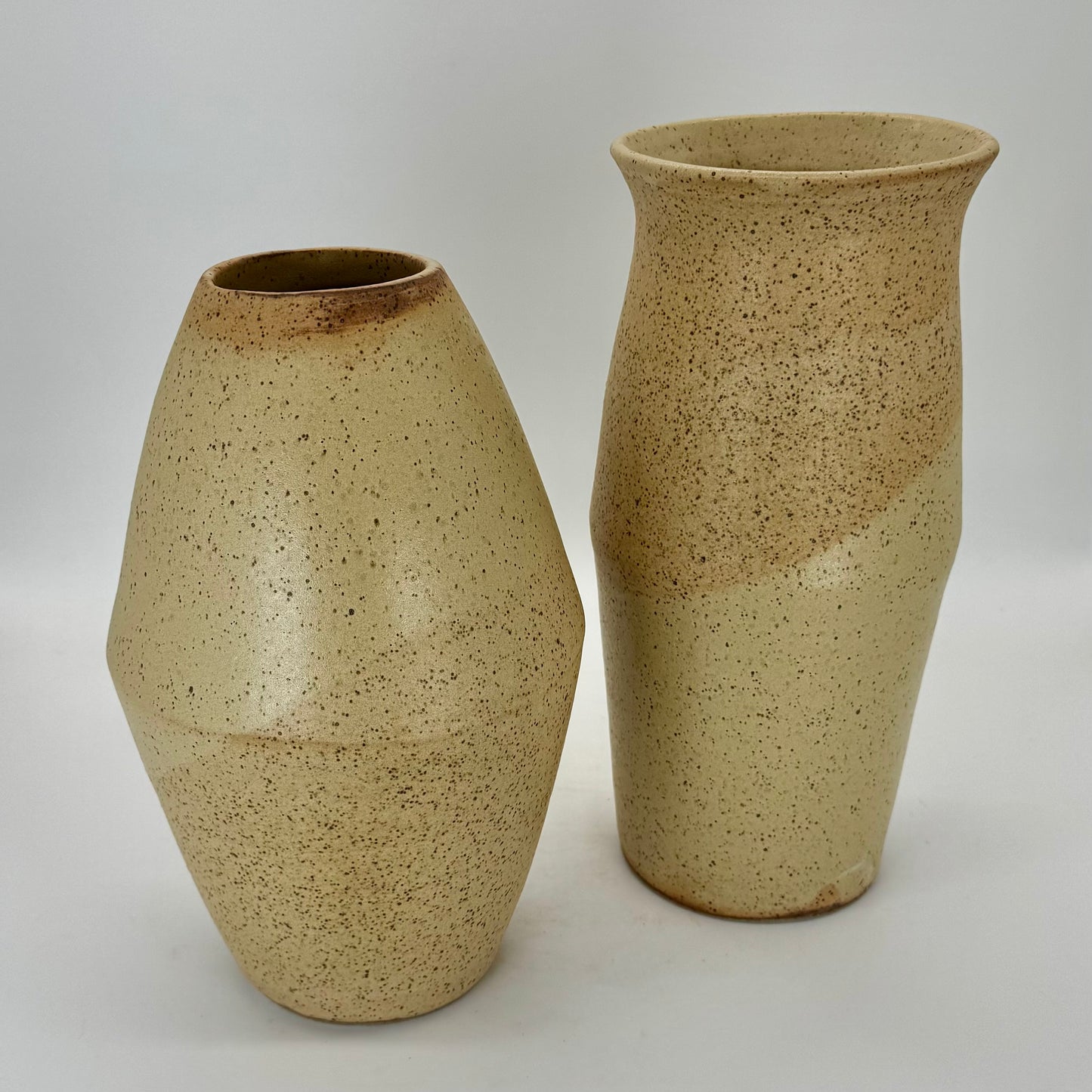 Tall farm egg vase created by joining two v-shaped bowls at the rime and flared at the top. This tall vase is finished in a matte farm egg glaze. Subtle and sturdy flecks of oxides in the clay.