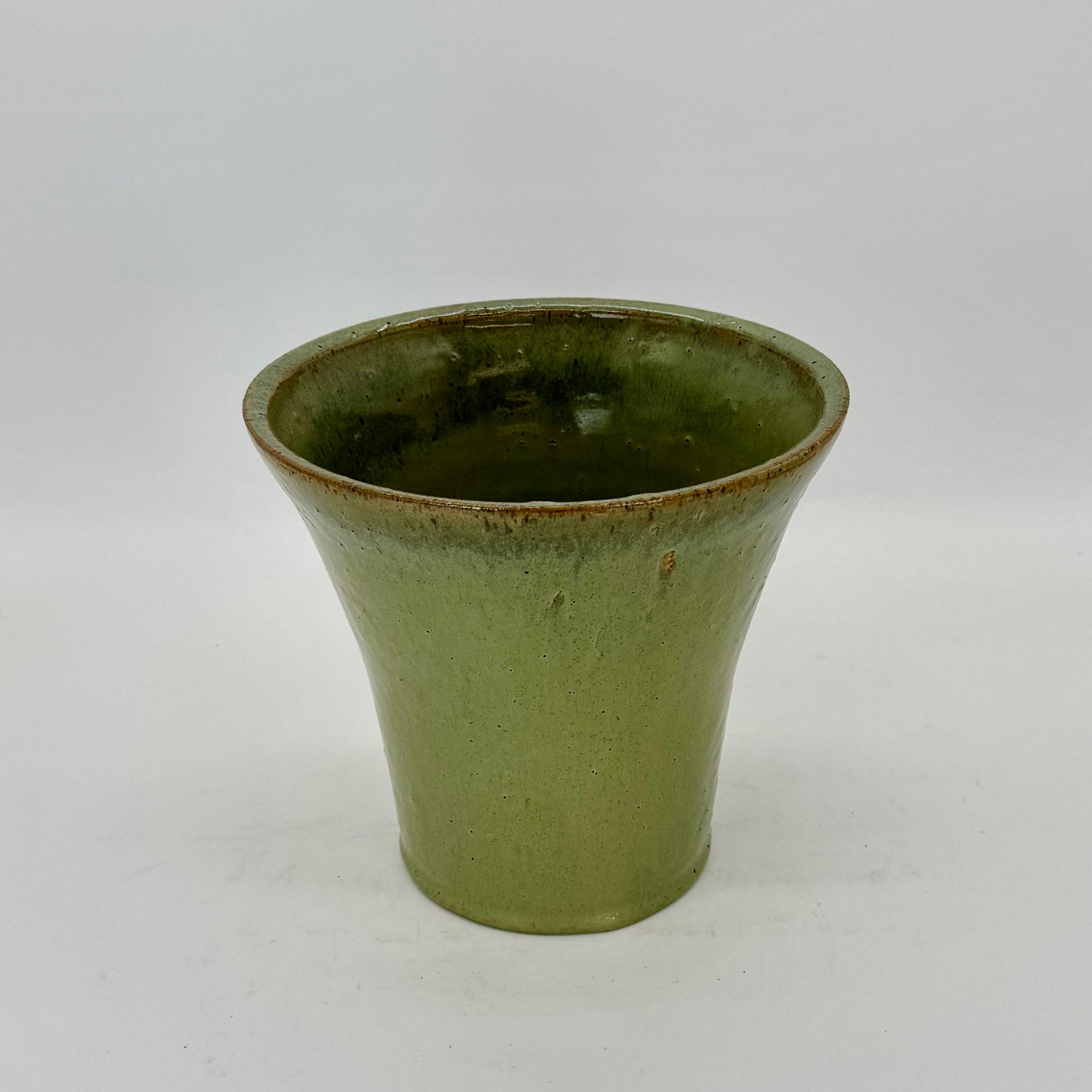 Wide rim vase. Finished in a double dip of sea mist glaze for a rick, mossy look.