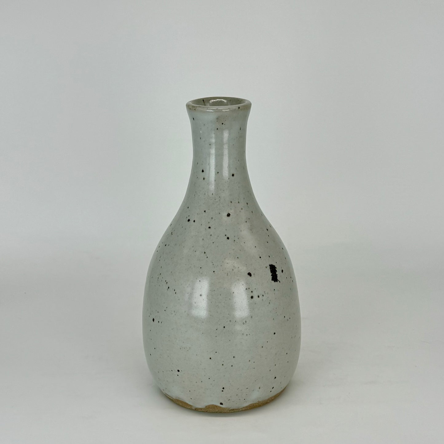 Large narrow neck bottle with beautiful touches of oxide that dripped from another piece in the kiln.