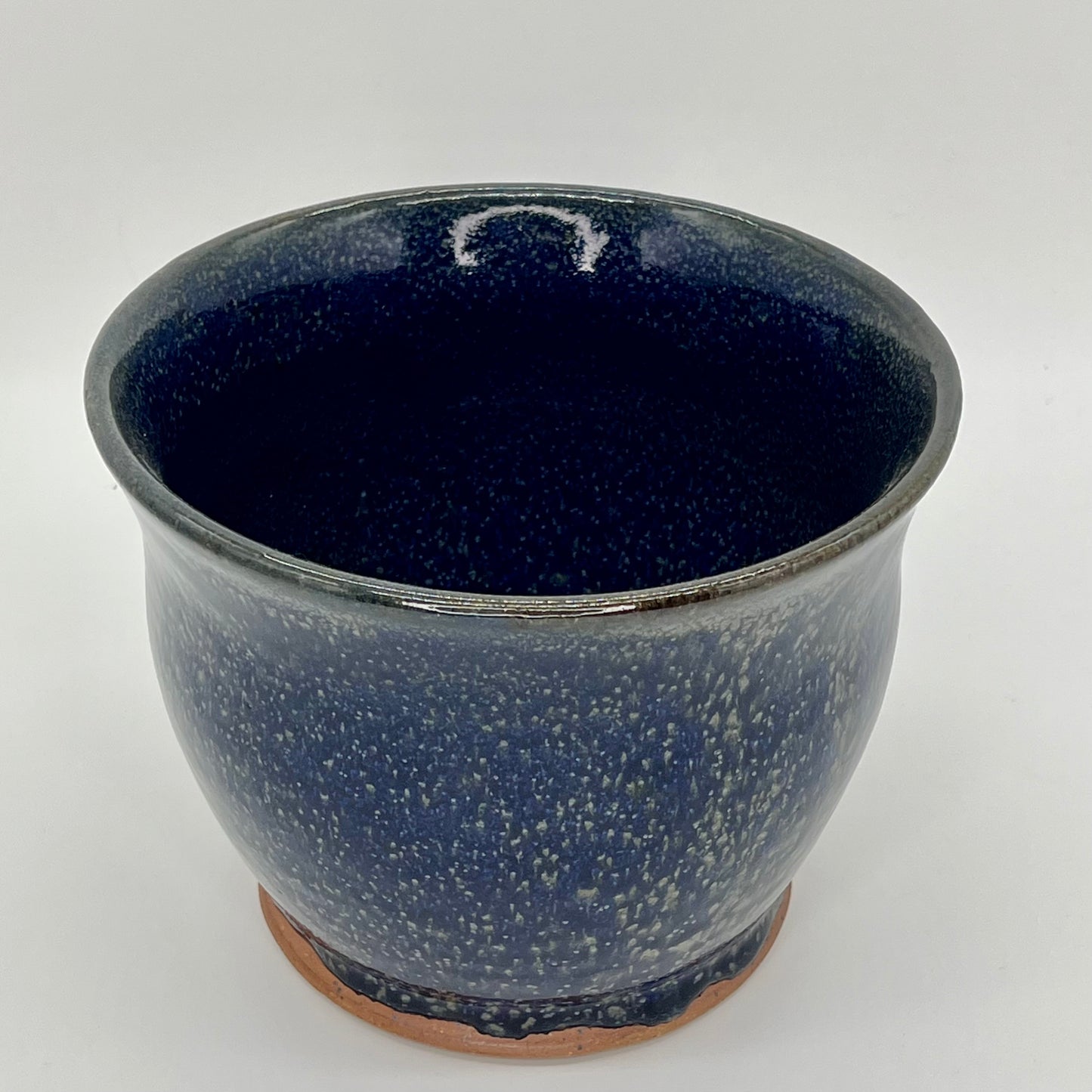 Large orchid pot in its traditional shape. The finish is double glazed in a rich blue and oribe green that leaves a speckled green effect.