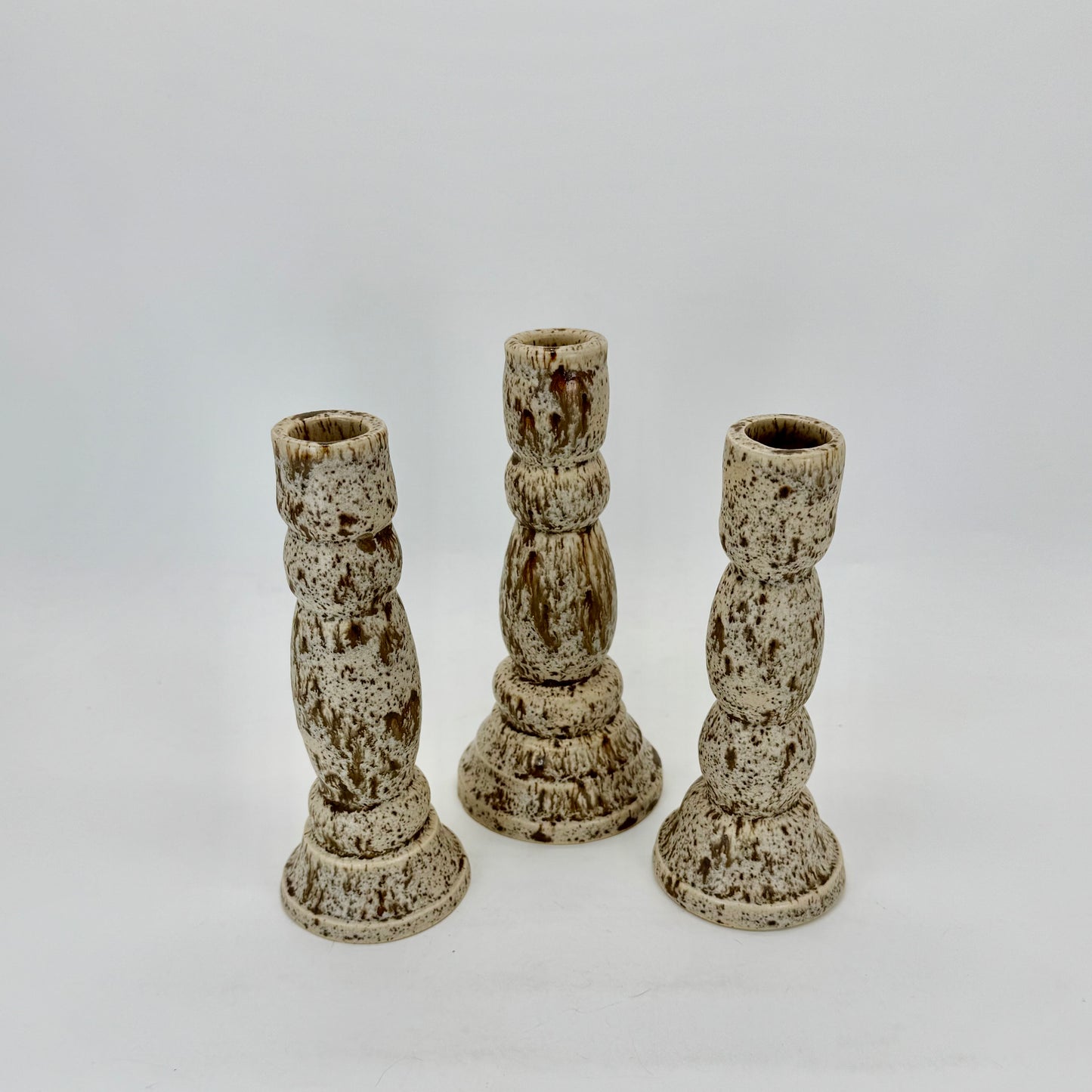 Set of three hefty, handsome Ceramic Candlesticks thrown on wheel and hand-carved. Winter wood glaze that looks like melted chocolate