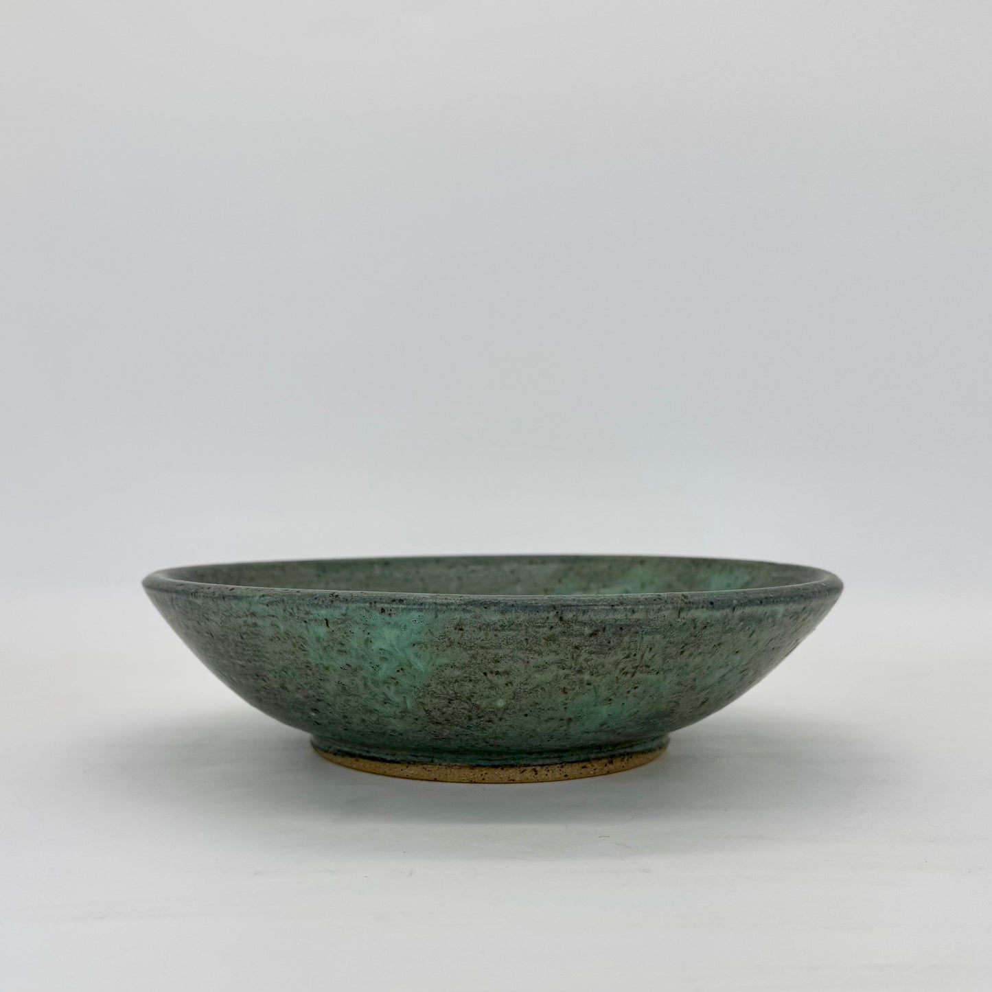 Large pasta bowl or serving dish. Footed and finished in hand-glazed stony blue