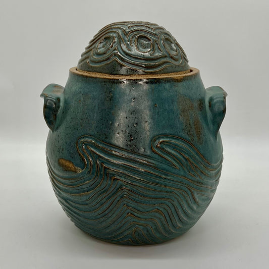 Sedimentary Pickle Jar with hand-built handles and carvings that echo the sediments found on many rocks of the North Fork. Finished in a satin blue spruce glaze.